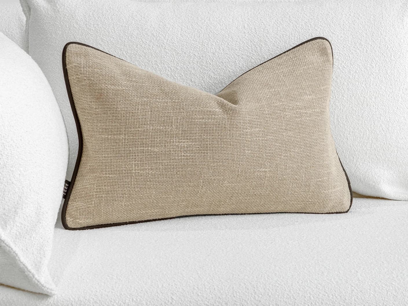 Beck Klimt II single cushions in cream, shown in a lifestyle front view