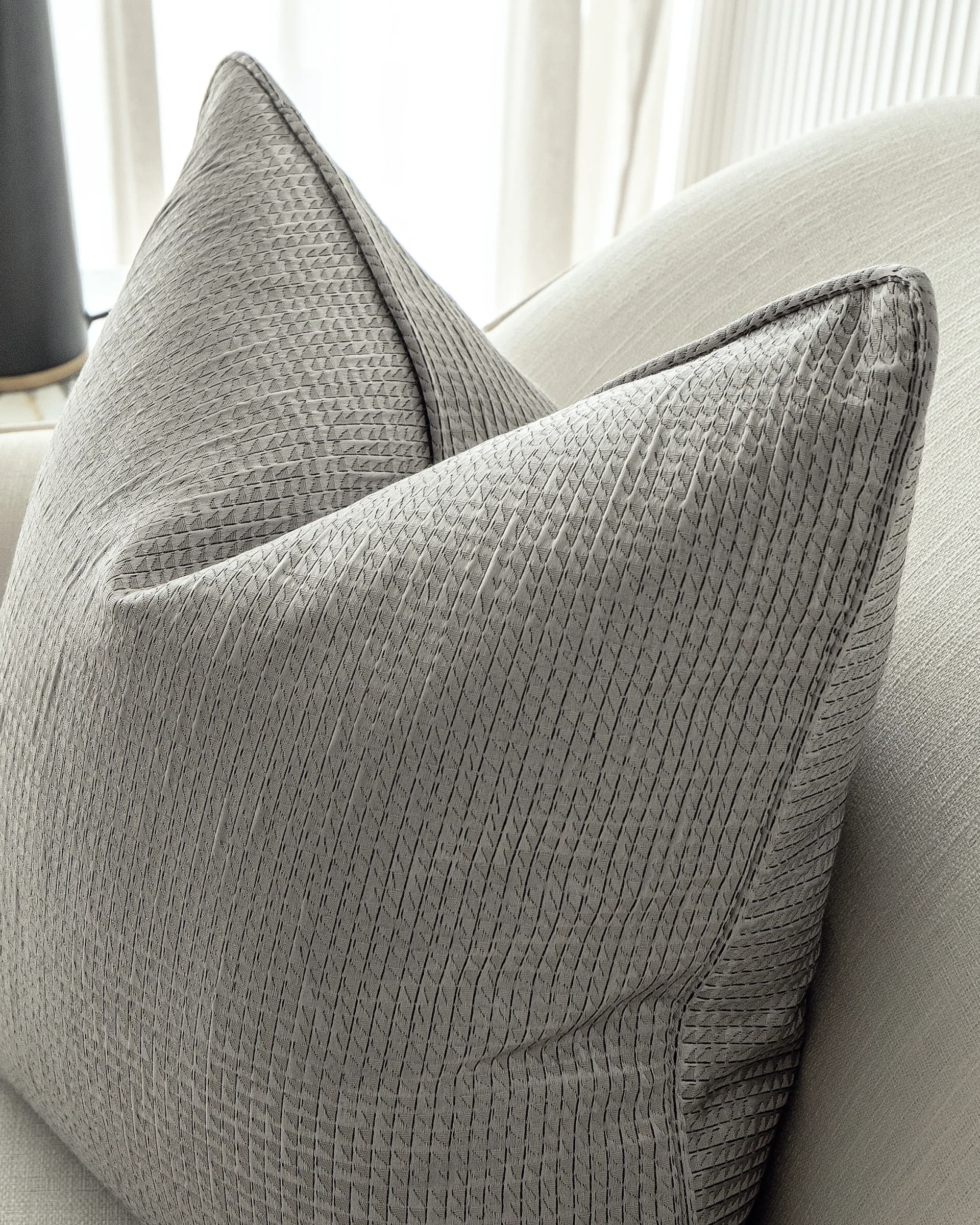 Benjamin Laurent cushion in silver and black, shown in a lifestyle close-up right view as image 6