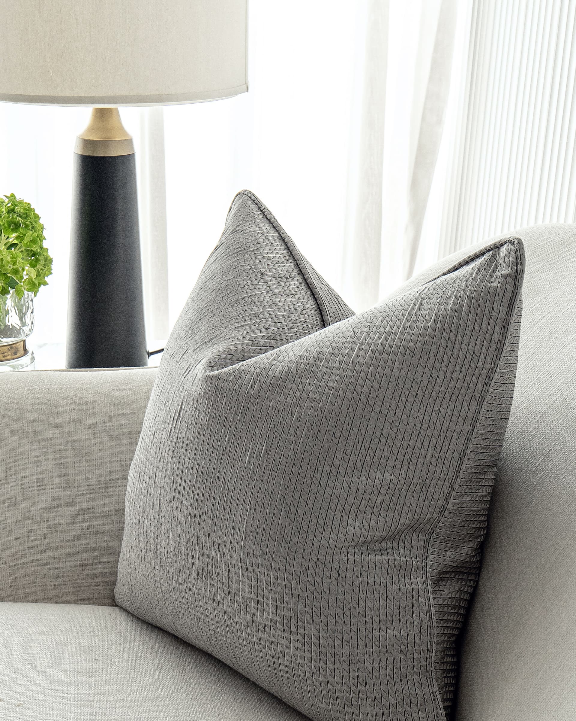 Benjamin Laurent cushion in silver and black, shown in a lifestyle close-up right view as image 5