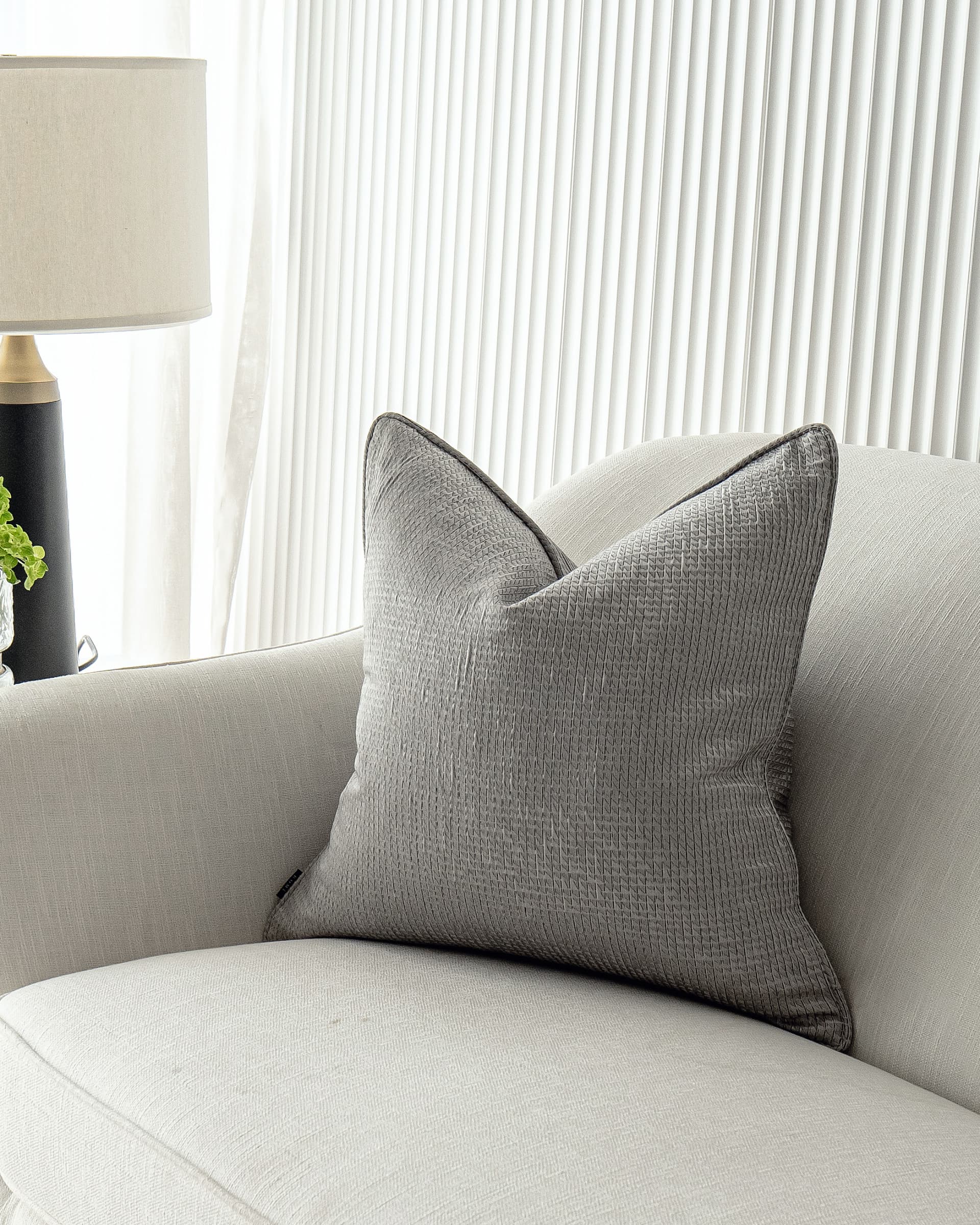 Benjamin Laurent cushion in silver and black, shown in a lifestyle close-up right view as image 2