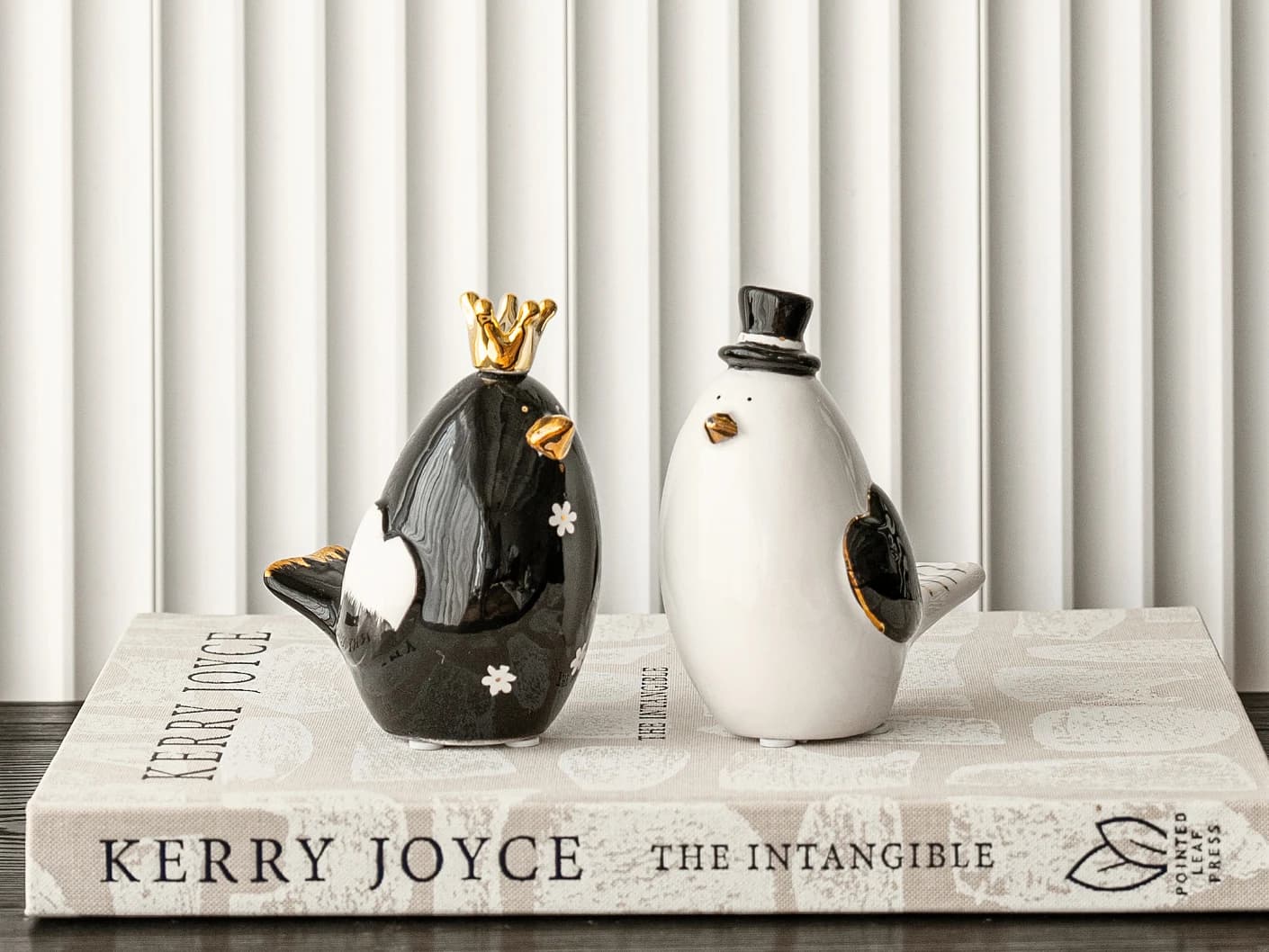 Berdy Arneson statues and sculptures in gold, white and black, shown in a lifestyle front view