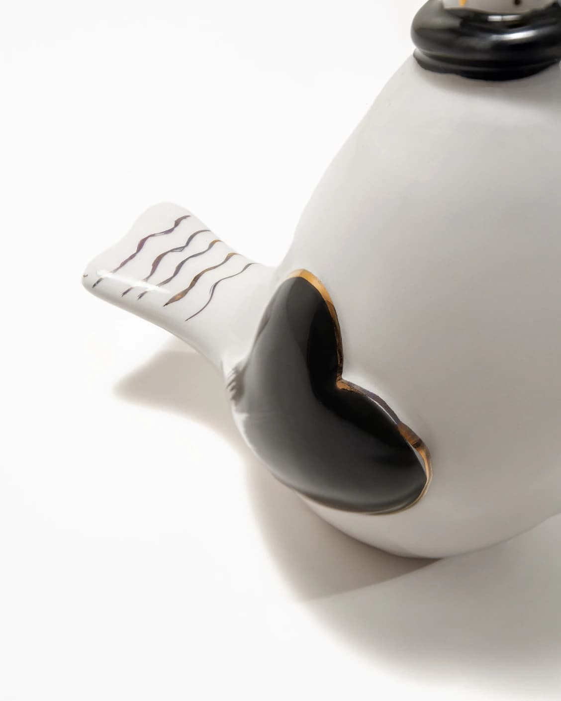 Berdy Arneson statues and sculptures in gold, white and black, shown in a product close-up back view as image 5