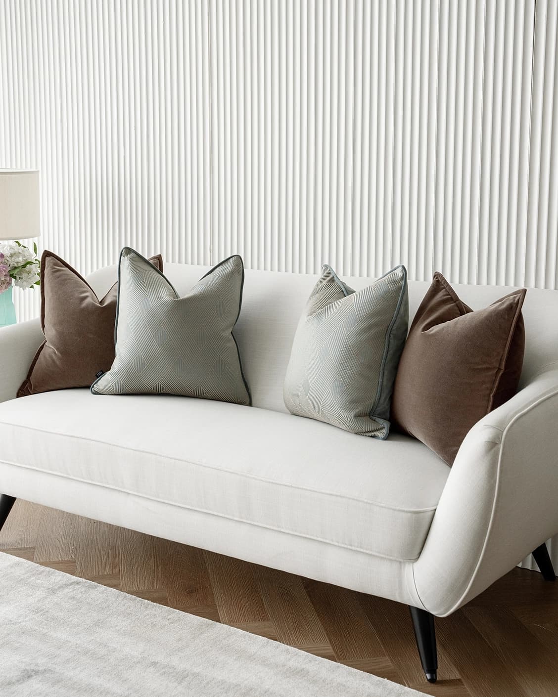 Bernie Bundle cushion in brown and blue, shown in a lifestyle right view as image 2