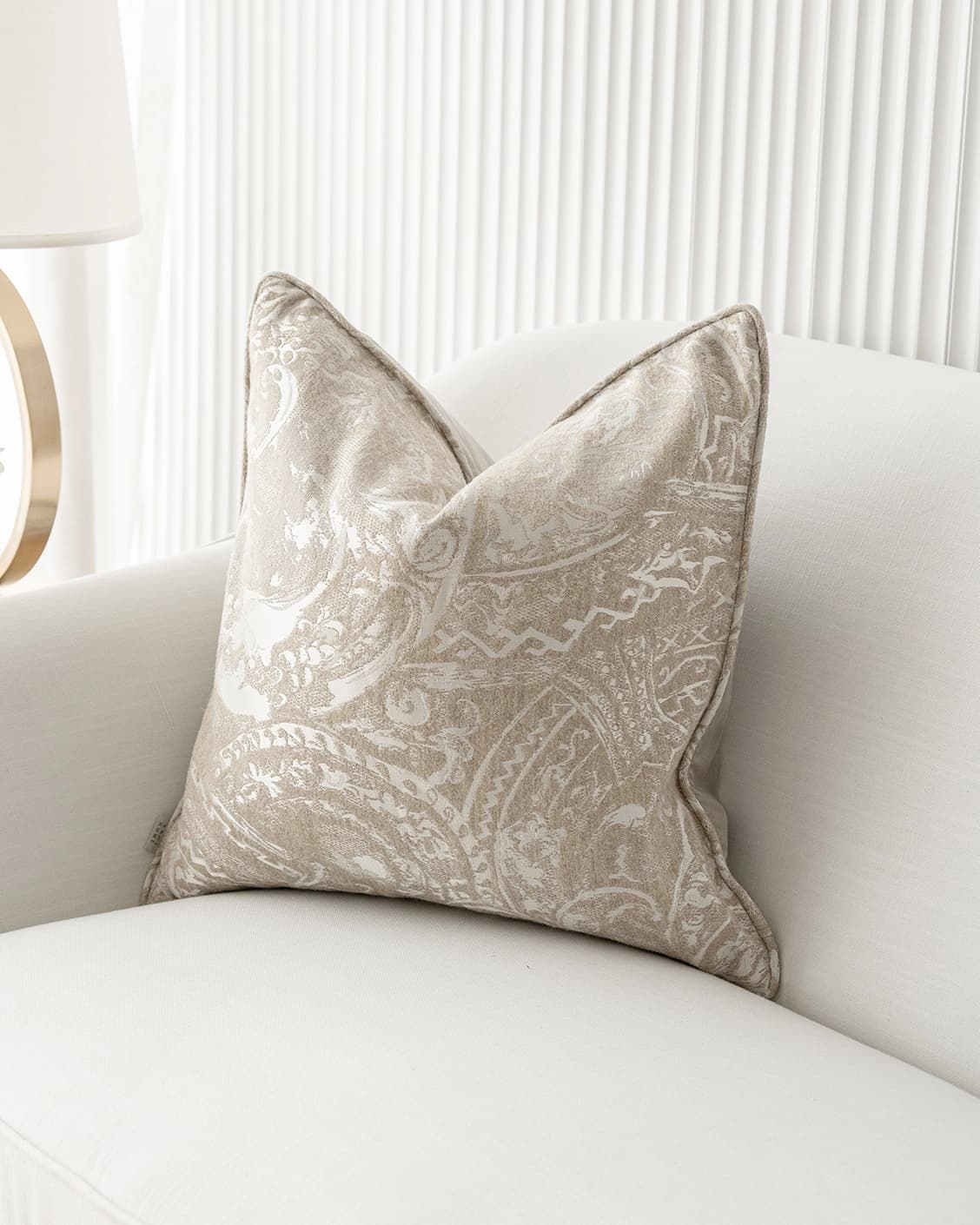 Berti Hodler cushion in beige and silver, shown in a lifestyle right view as image 2
