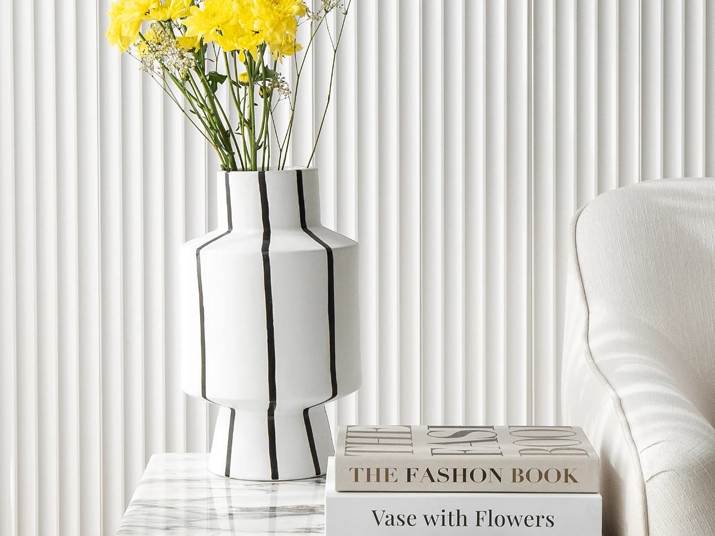 Bethany Arneson vases in white and black, shown in a lifestyle view