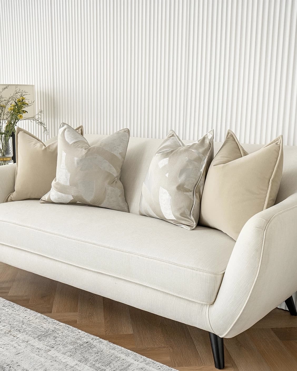 Bethyna Bundle cushion in beige and silver, shown in a lifestyle right view as image 2