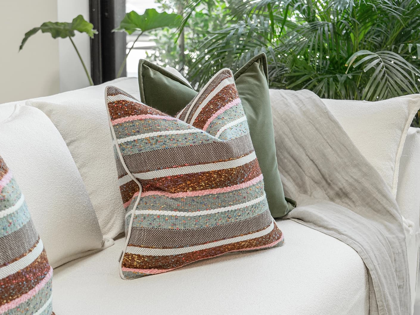 Blaire Bundle bundle cushions in multicolour and green, shown in a lifestyle front view