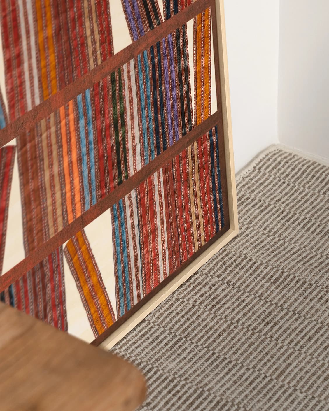 Books canvas in rust, blue and multicolour, shown in a lifestyle close-up as image 5