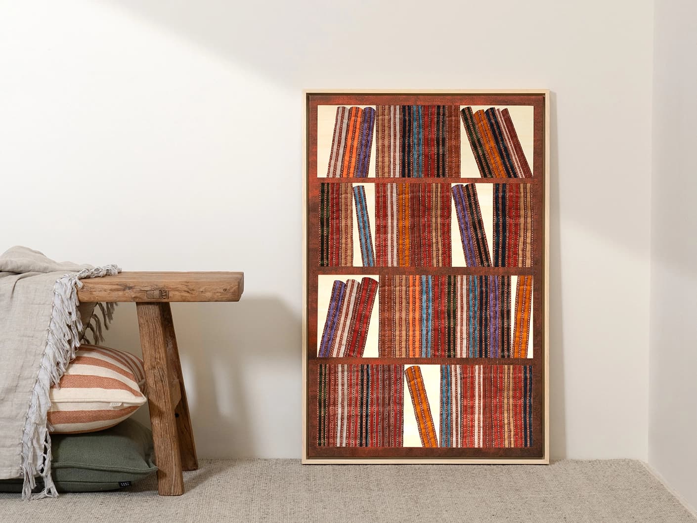 Books canvas artwork in rust, blue and multicolour, shown in a lifestyle front view