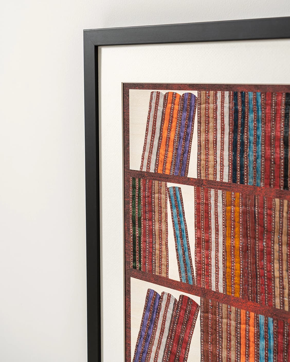 Books fine art print in rust, blue and multicolour, shown in a lifestyle close-up view as image 6