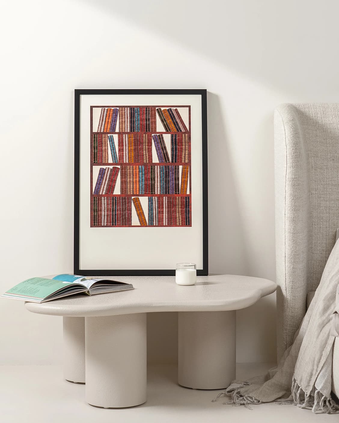 Books fine art print in rust, blue and multicolour, shown in a lifestyle front view as image 2