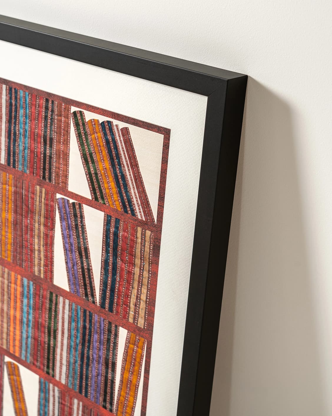 Books fine art print in rust, blue and multicolour, shown in a lifestyle left view as image 4