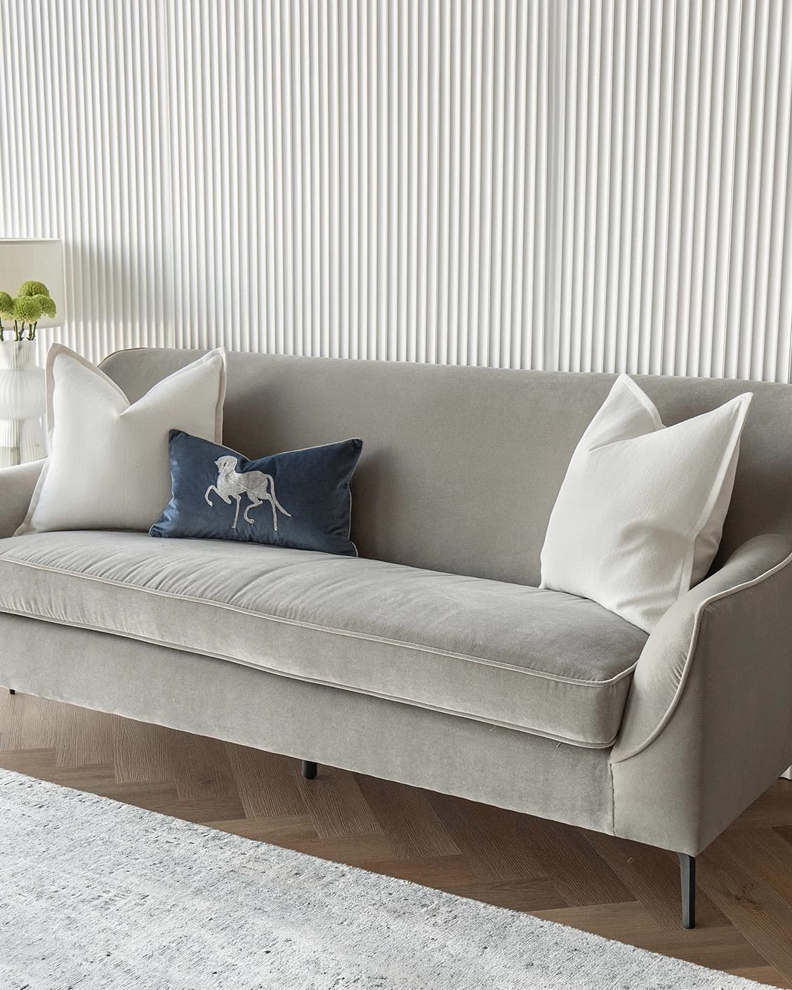 Brent Bundle cushion in white, blue and silver, shown in a lifestyle right view as image 2