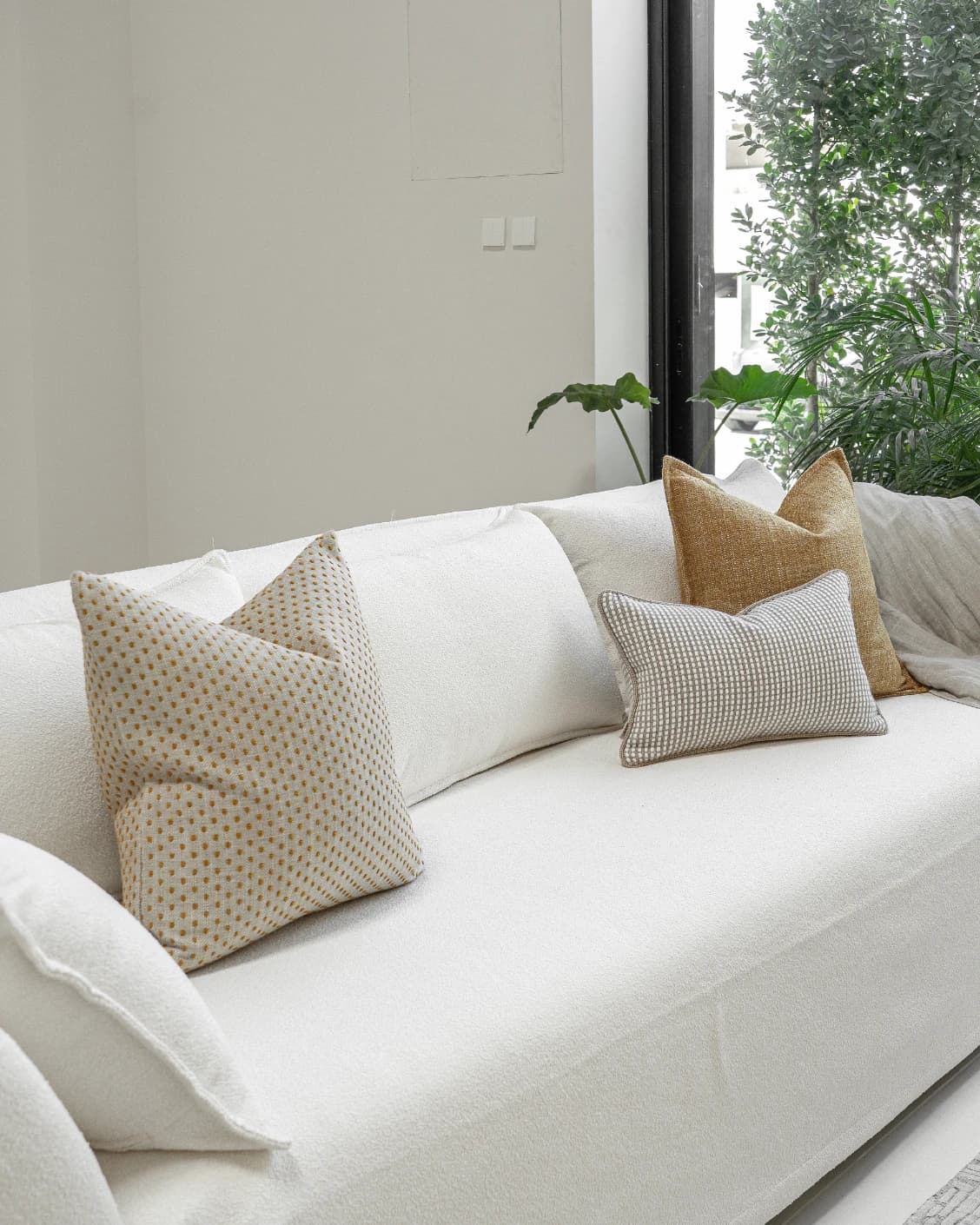 Bryan Bundle cushion in yellow and white, shown in a lifestyle left view as image 2