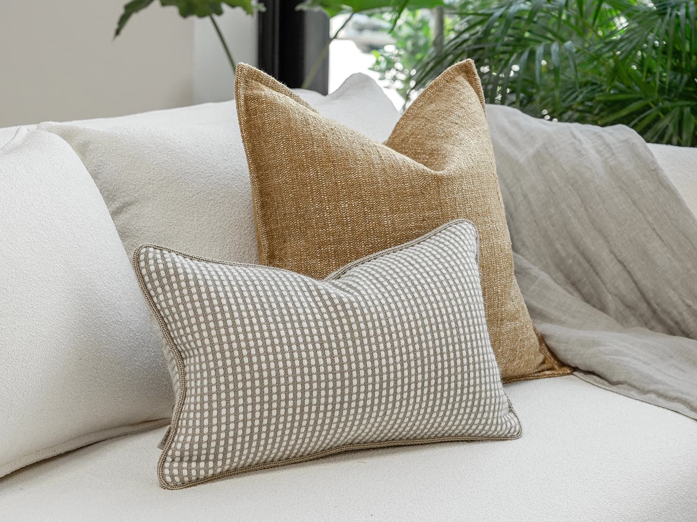 Bryan Bundle bundle cushions in yellow and white, shown in a lifestyle front view