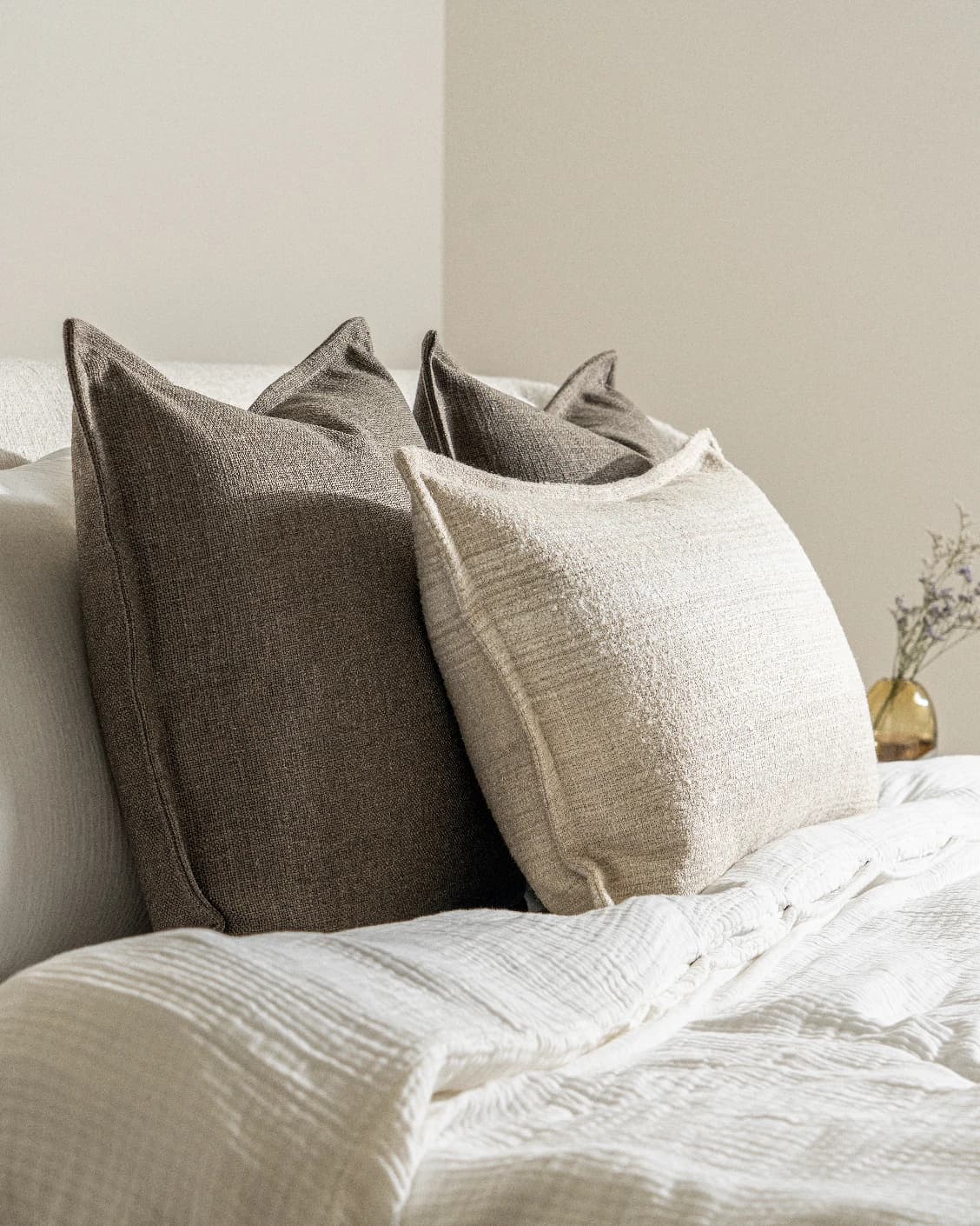 Burhan Bundle cushion in brown and beige, shown in a lifestyle left view as image 6
