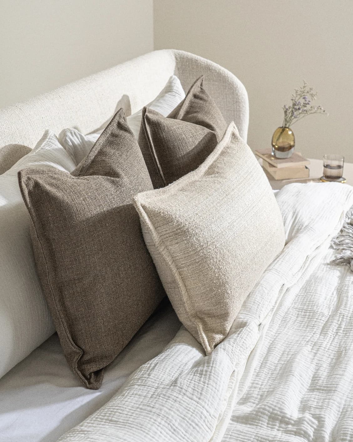 Burhan Bundle cushion in brown and beige, shown in a lifestyle left view as image 7