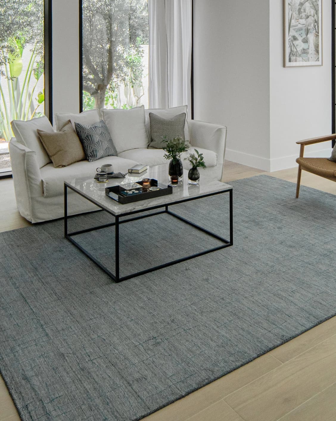 Caleb Ashton Round carpet in grey, teal and blue, shown in a lifestyle left view as image 7