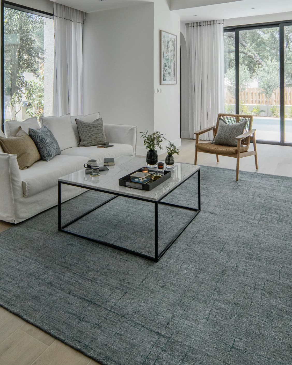 Caleb Ashton Round carpet in grey, teal and blue, shown in a lifestyle left view as image 8