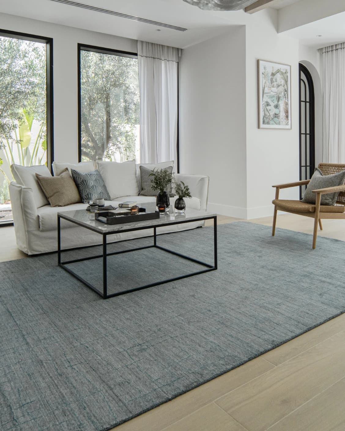 Caleb Ashton Round carpet in grey, teal and blue, shown in a lifestyle left view as image 6