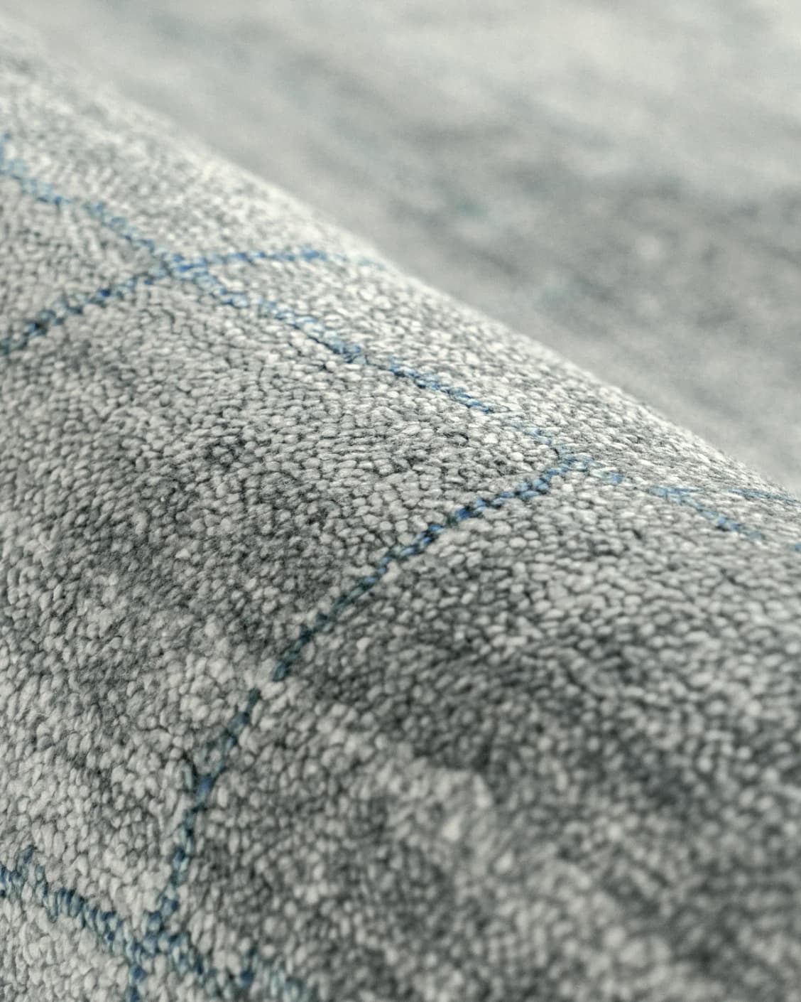 Caleb Ashton Round carpet in grey, teal and blue, shown in a product close-up as image 16