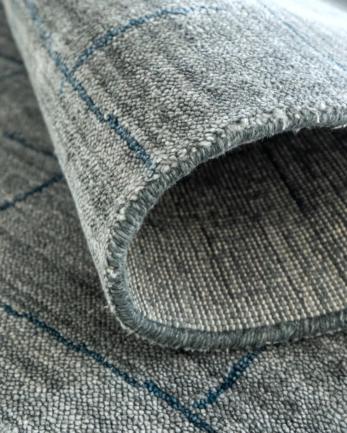 Caleb Ashton Round carpet in grey, teal and blue, shown in a product close-up as image 14