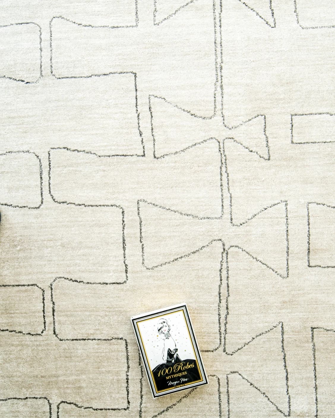 Caleb Ebony carpet in ebony, pearl and grey, shown in a lifestyle top view as image 10