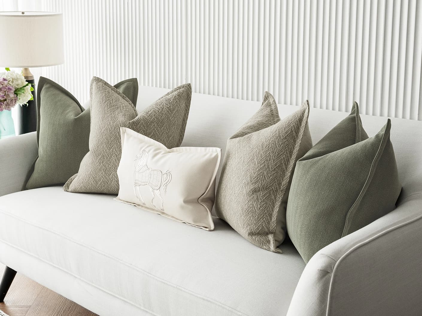 Cali Bundle bundle cushions in white, beige and green, shown in a lifestyle front view