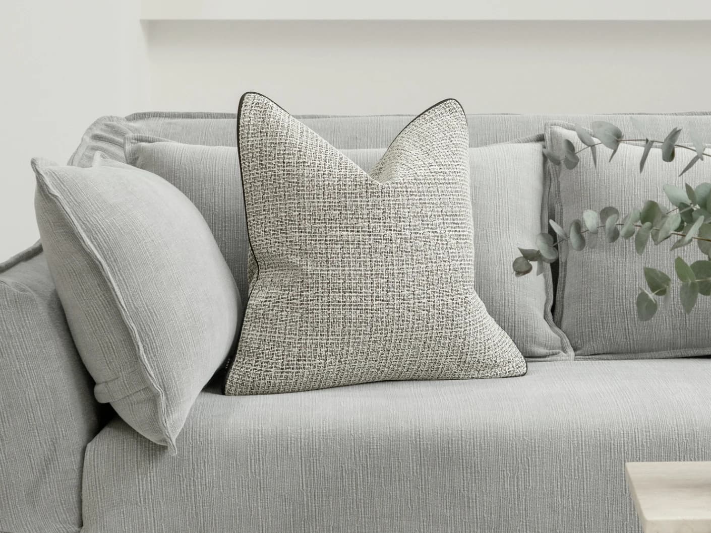 Cami Steele single cushions in charcoal, shown in a lifestyle front view