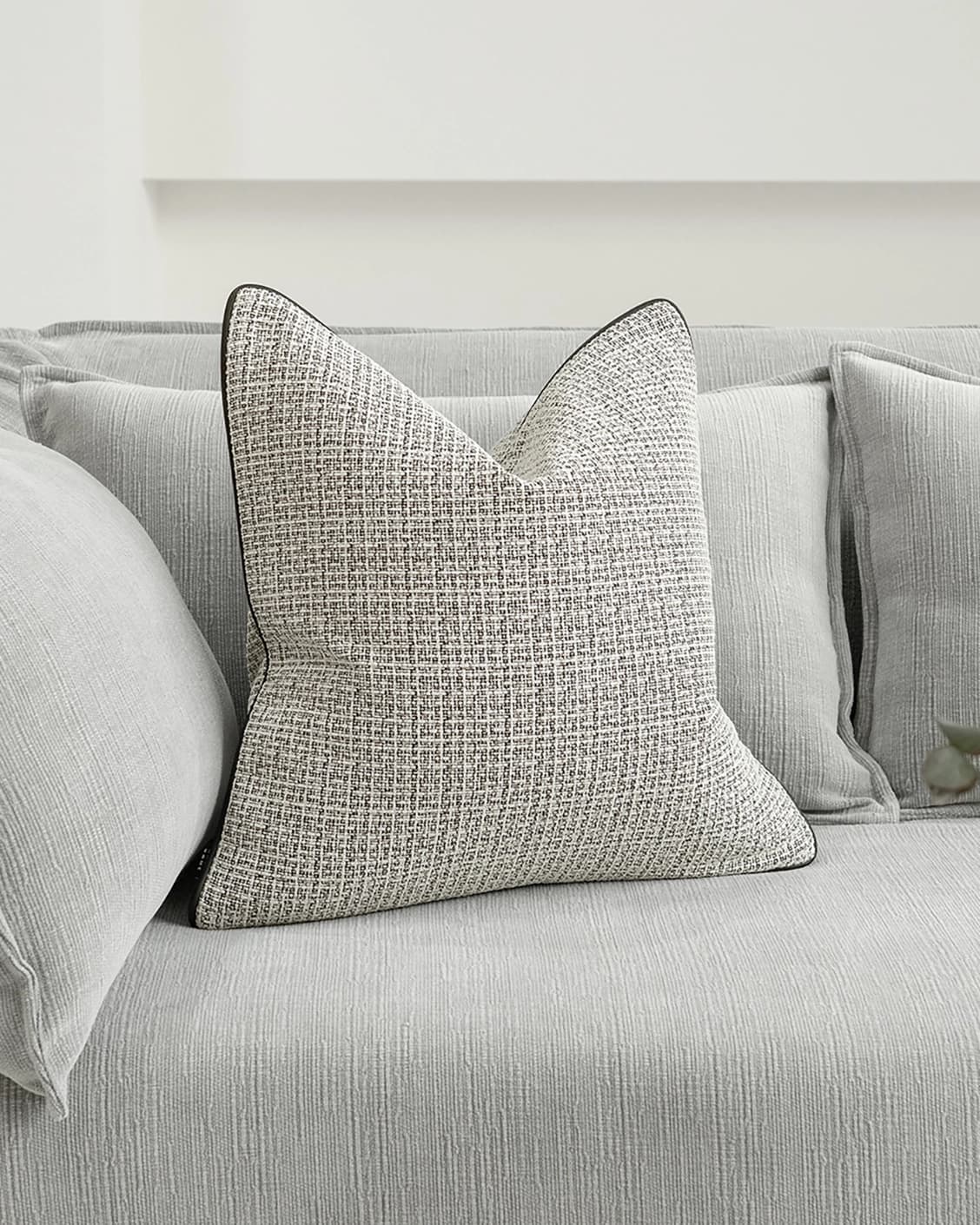 Cami Steele cushion in charcoal, shown in a lifestyle front view as image 2