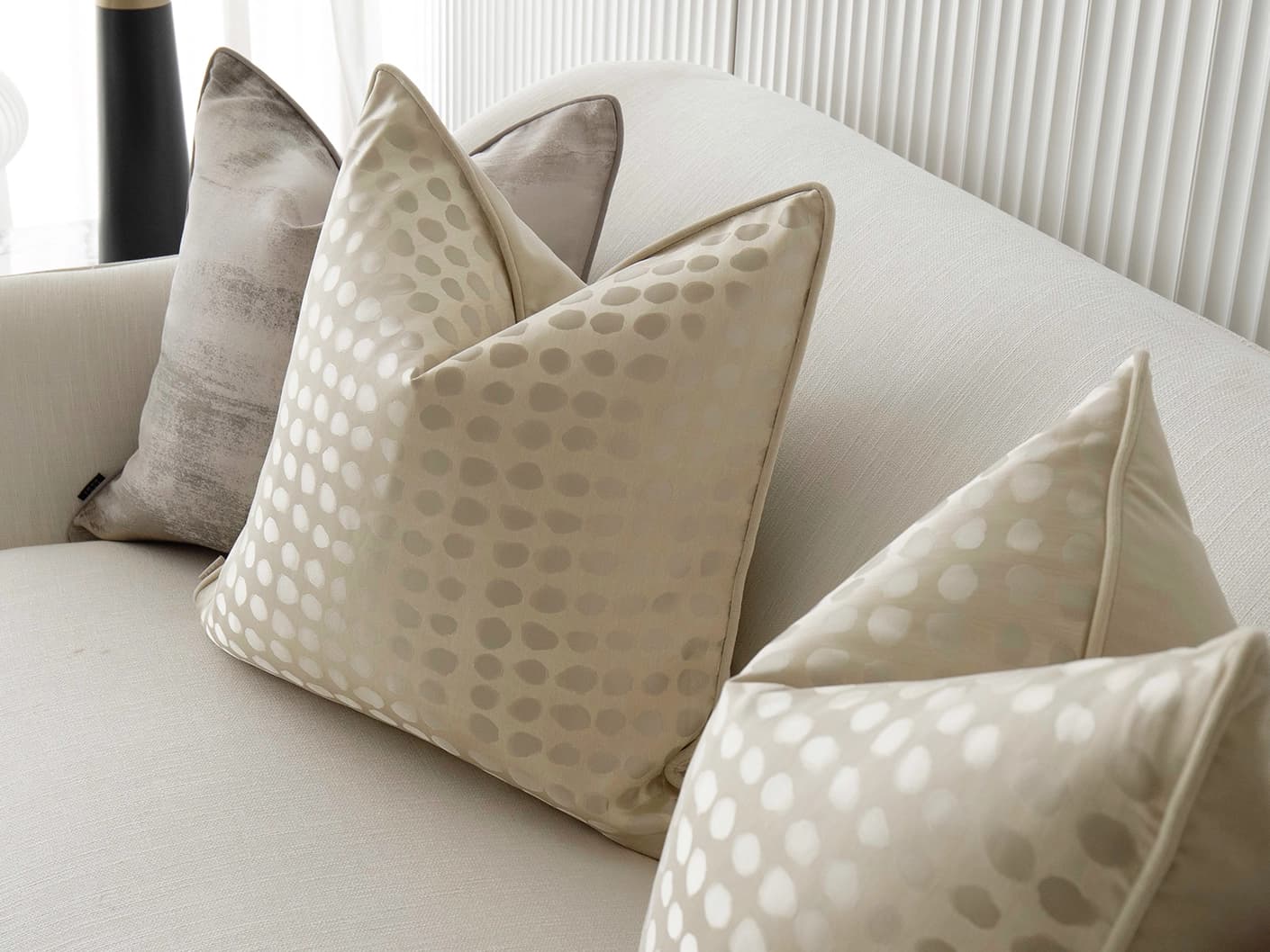 Candace Bundle bundle cushions in yellow, silver, beige and gold, shown in a lifestyle front view