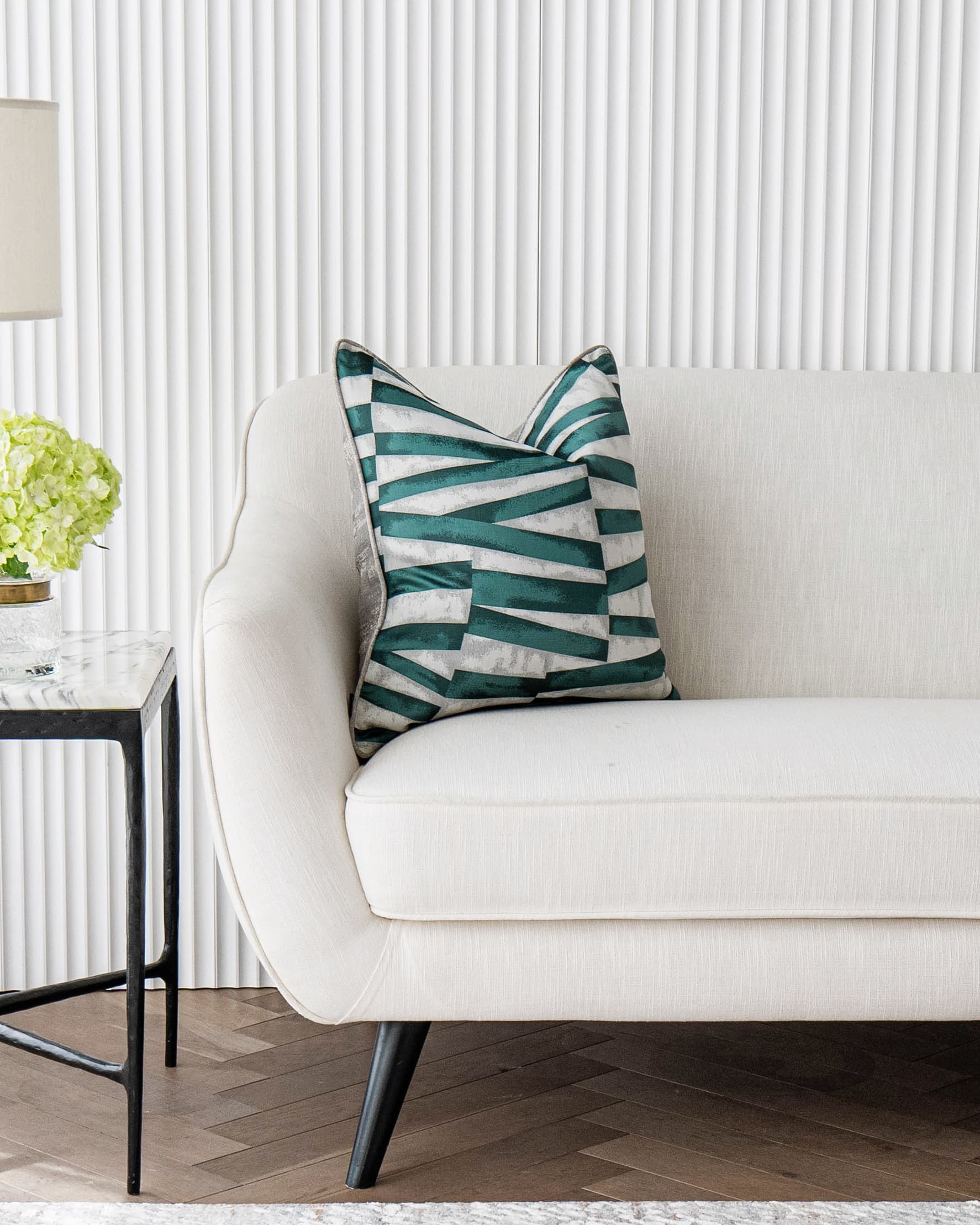 Carlie Teal cushion in teal, turquoise, blue and green, shown in a lifestyle front view as image 4