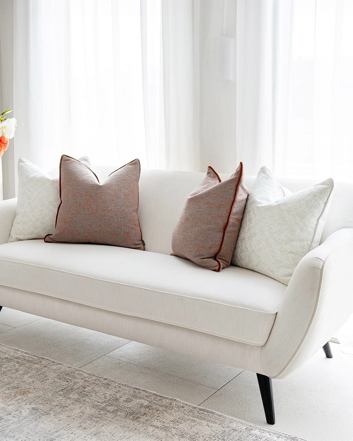 Cassie Bundle cushion in orange, white and red, shown in a product right view as image 2