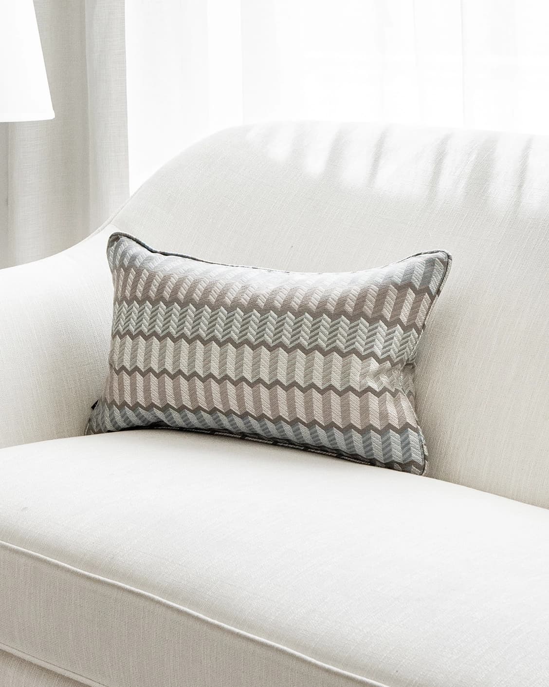 Cecilia Canova II cushion in silver, blue and multicolour, shown in a lifestyle right view as image 2