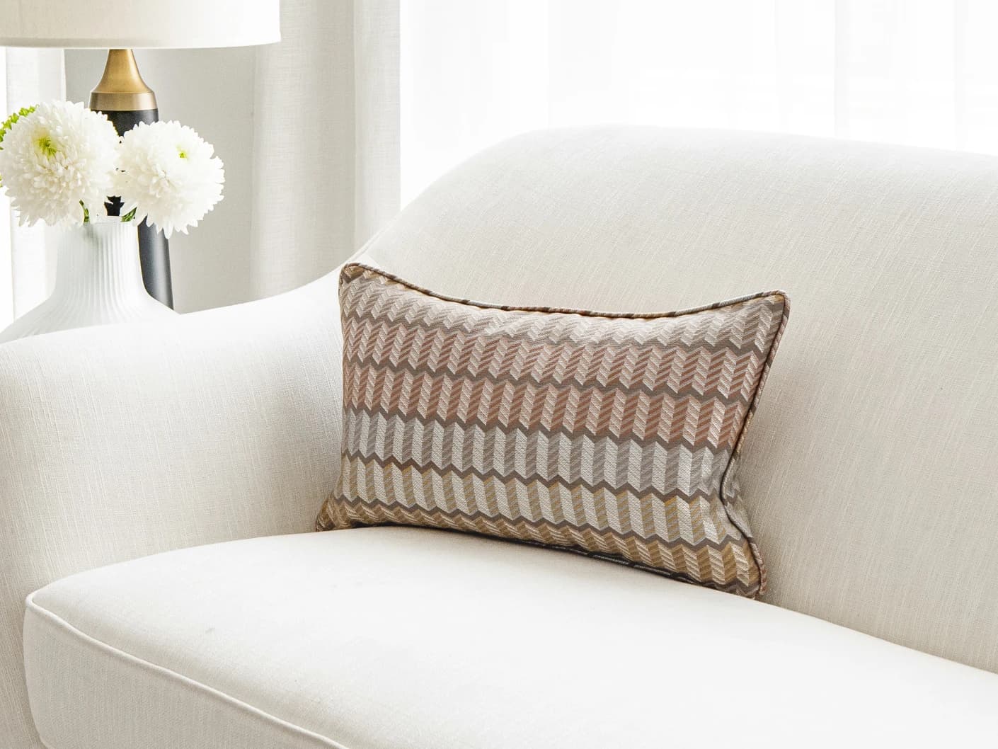 Cecilia Hodler II single cushions in orange, yellow and multicolour, shown in a lifestyle right view