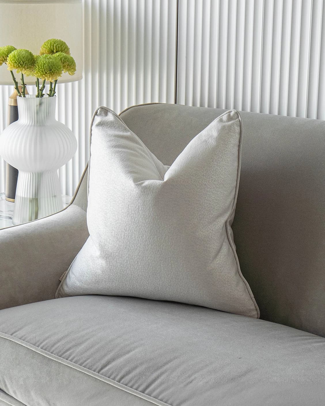Celeste Hodler cushion in silver, shown in a lifestyle front view as image 2