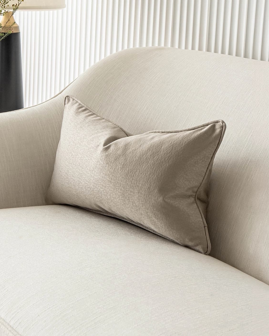 Celeste Laurent II cushion in gold and beige, shown in a lifestyle front view as image 2