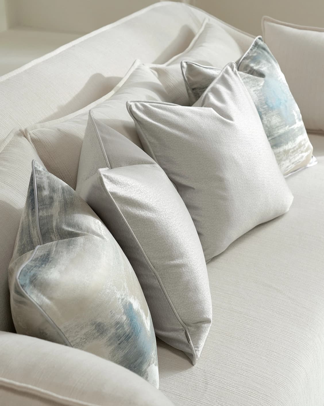 Celia Bundle cushion in blue and silver, shown in a lifestyle right view as image 2
