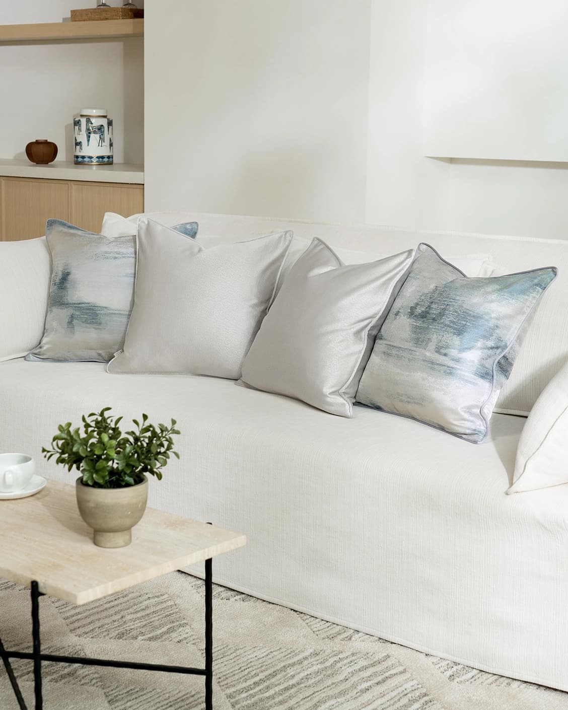 Celia Bundle cushion in blue and silver, shown in a lifestyle right view as image 2