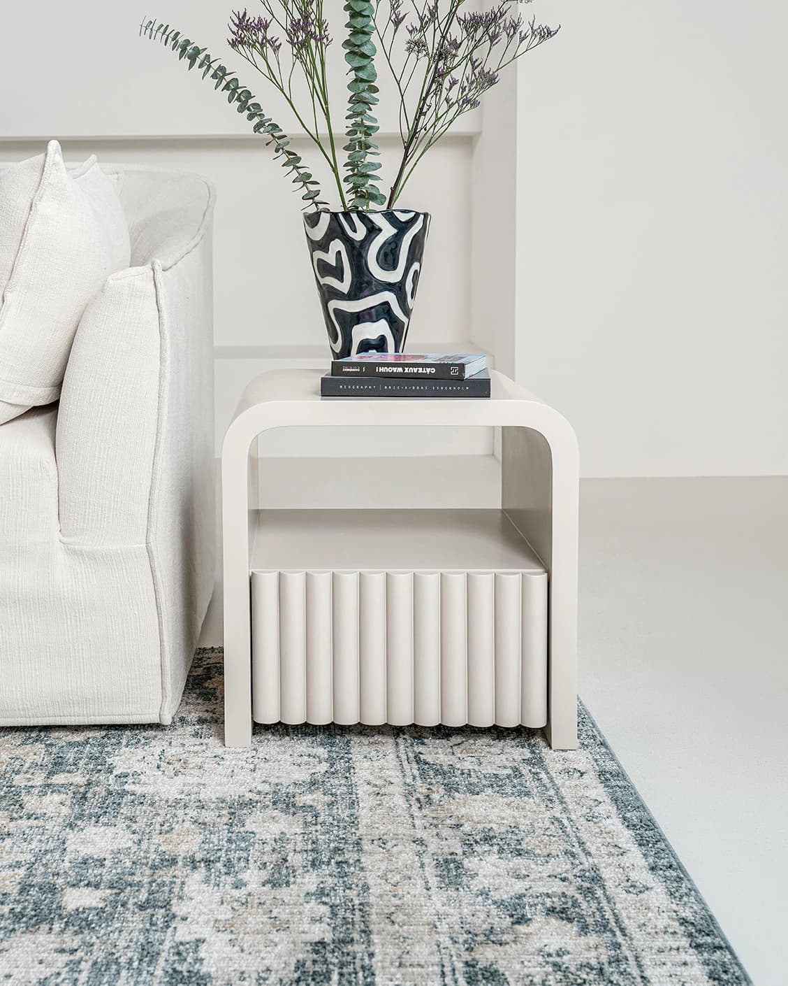 Celia nightstand in soft ivory and stone, shown in a lifestyle front view as image 2