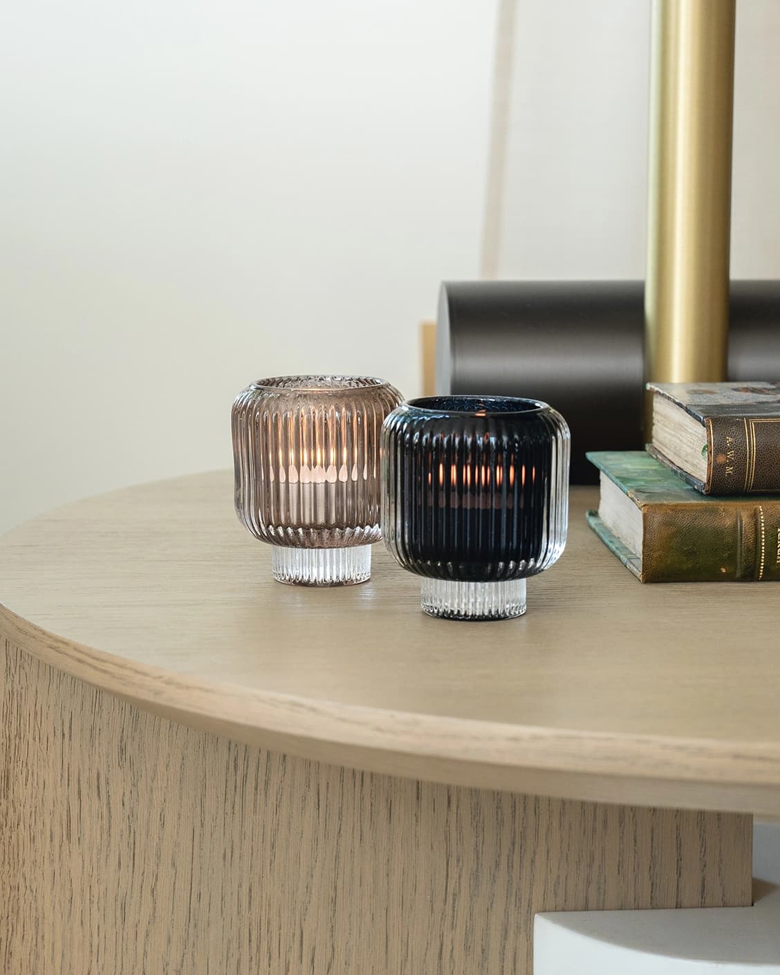 Chandelle Storms candle holders in black and taupe, shown in a lifestyle right view as image 2