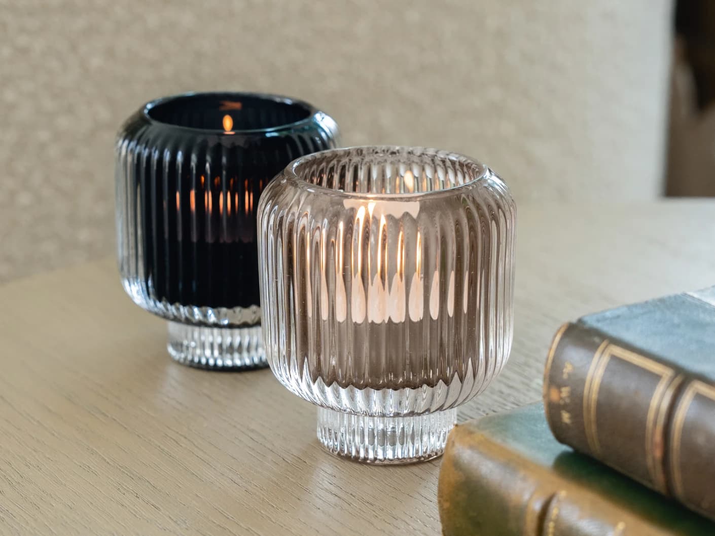 Chandelle Storms candle holders in black and taupe, shown in a lifestyle right view