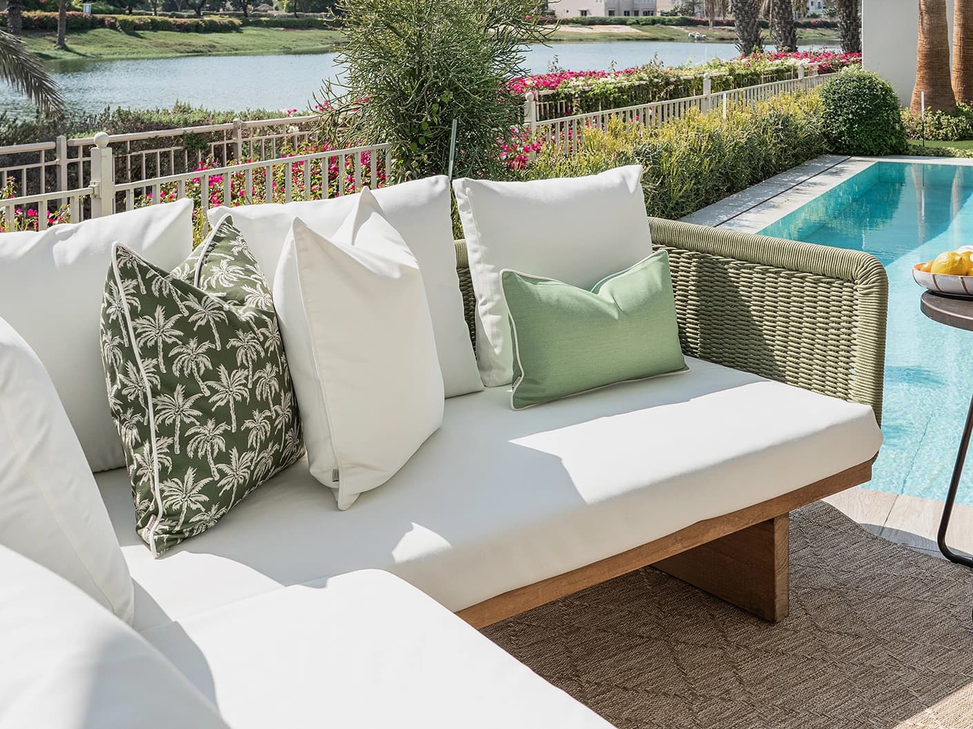 Chaya Bundle bundle cushions in green and ivory, shown in a lifestyle front view