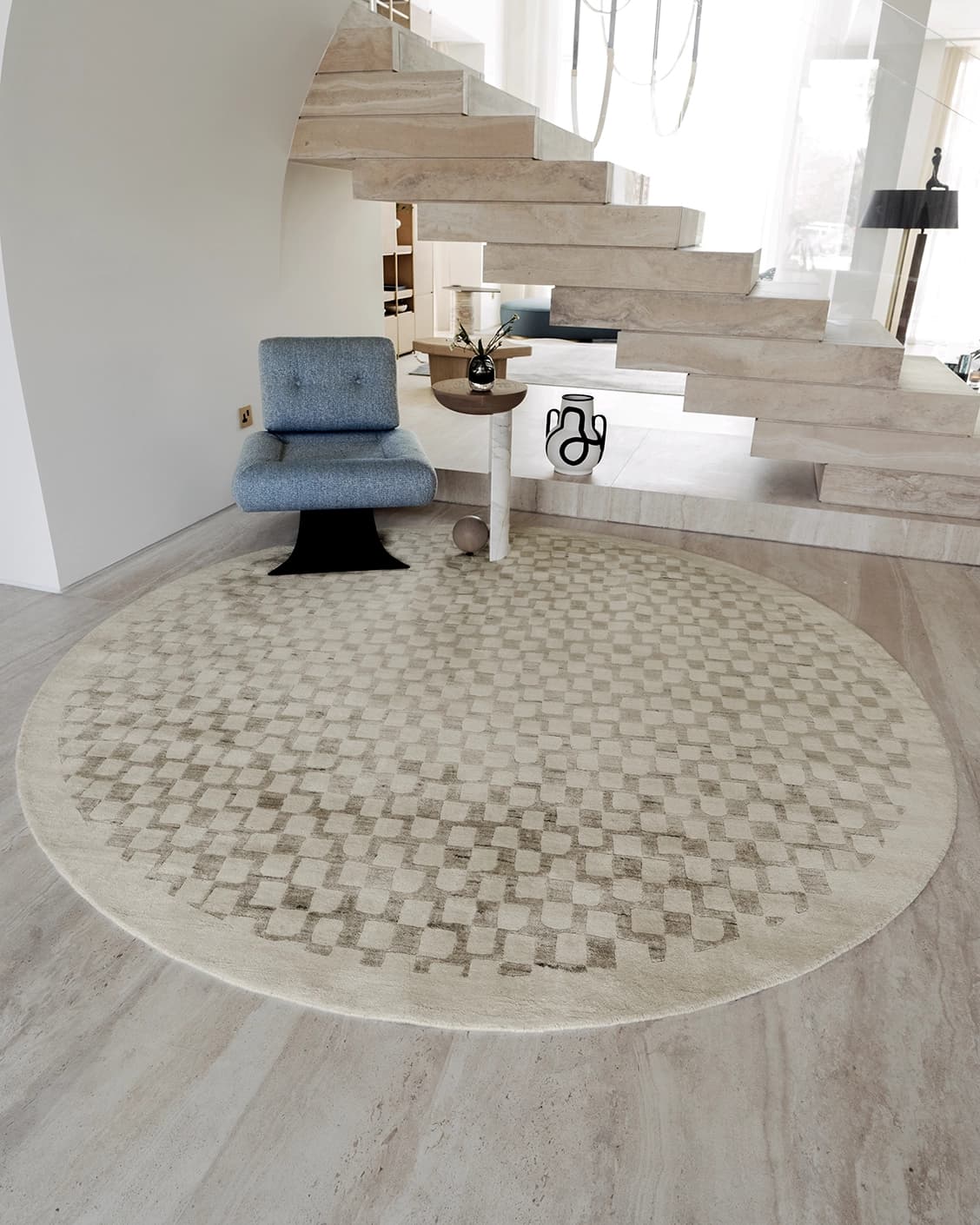 Chess Dune Round carpet in dune, taupe and beige, shown in a lifestyle front view as image 2