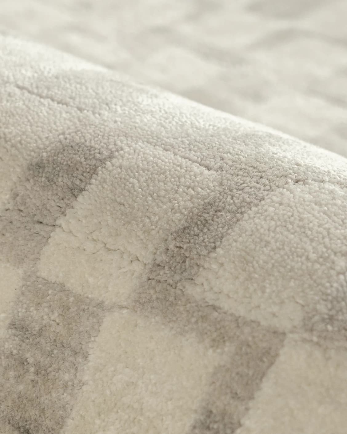 Chess Dune carpet in taupe and beige, shown in a lifestyle close-up as image 4