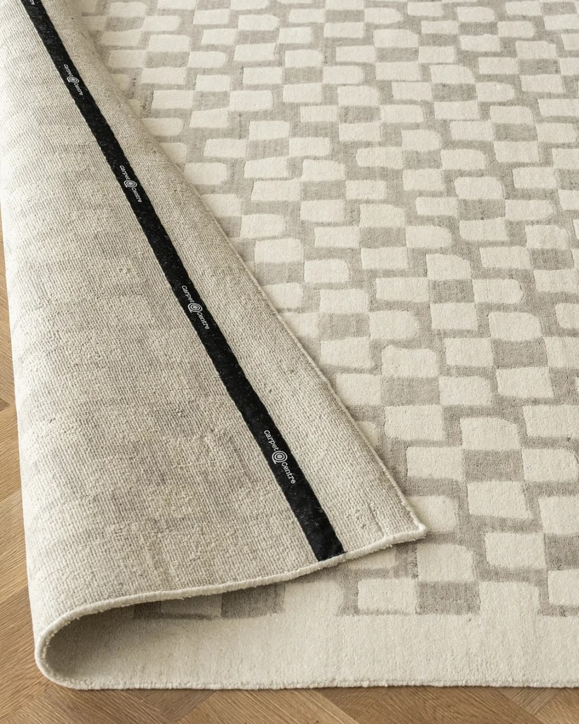 Chess Dune carpet in taupe and beige, shown in a lifestyle close-up as image 6