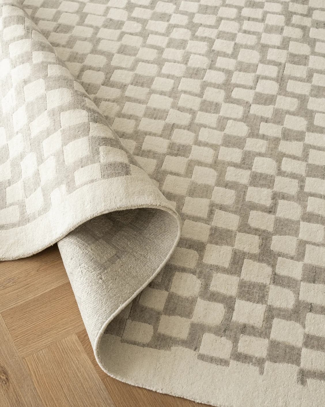 Chess Dune carpet in taupe and beige, shown in a lifestyle close-up as image 7