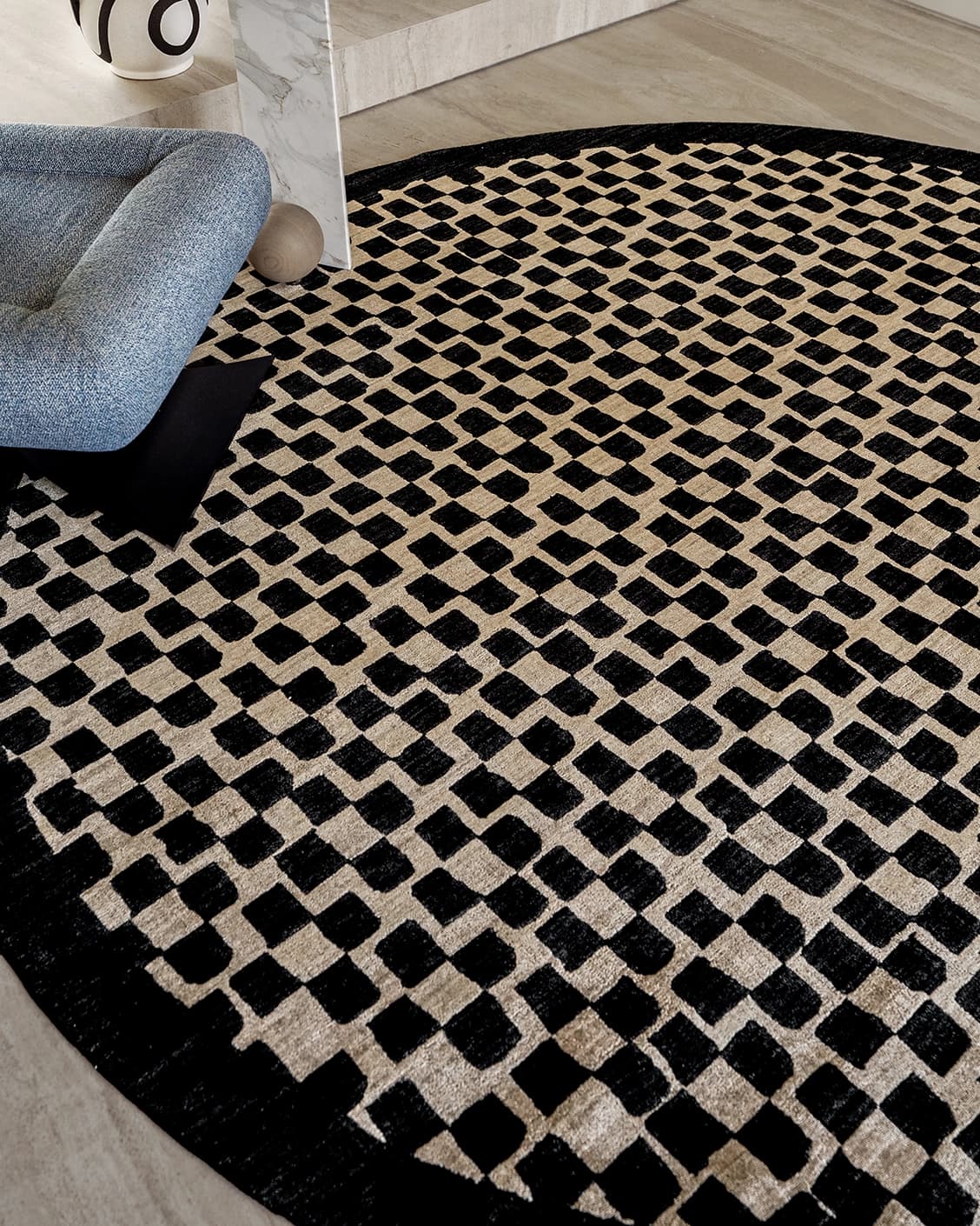 Chess Ebony carpets in beige and black, shown in a lifestyle close-up top view as image 2