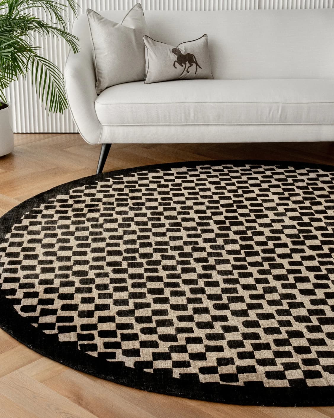 Chess Ebony Round carpet in ebony, beige and black, shown in a lifestyle front view as image 5