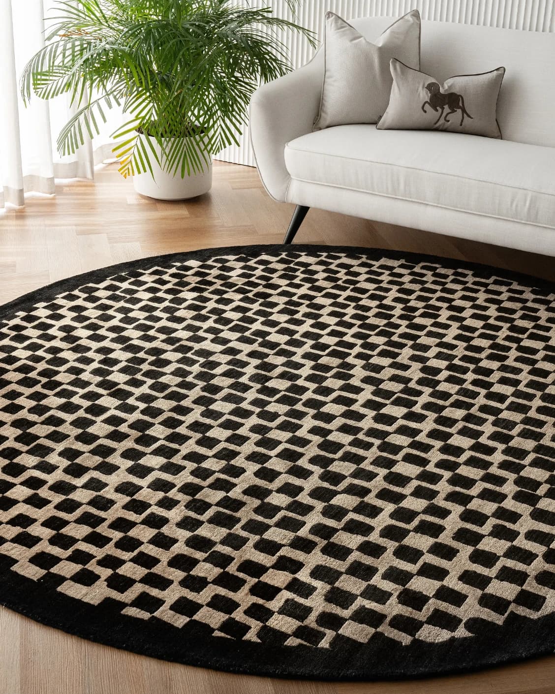 Chess Ebony Round carpet in ebony, beige and black, shown in a lifestyle front view as image 6